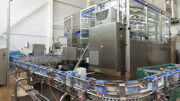 Conveyor line at the dairy plant.Dairy products in paper packaging, conveyor, automatic production line